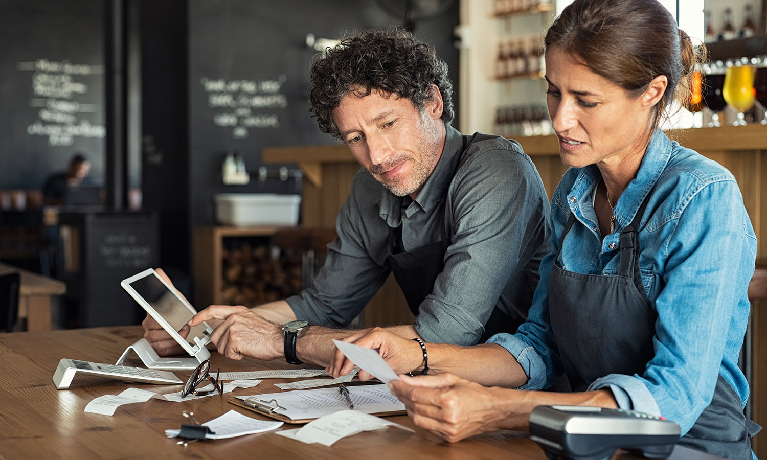 restaurant owners looking at insurance policy