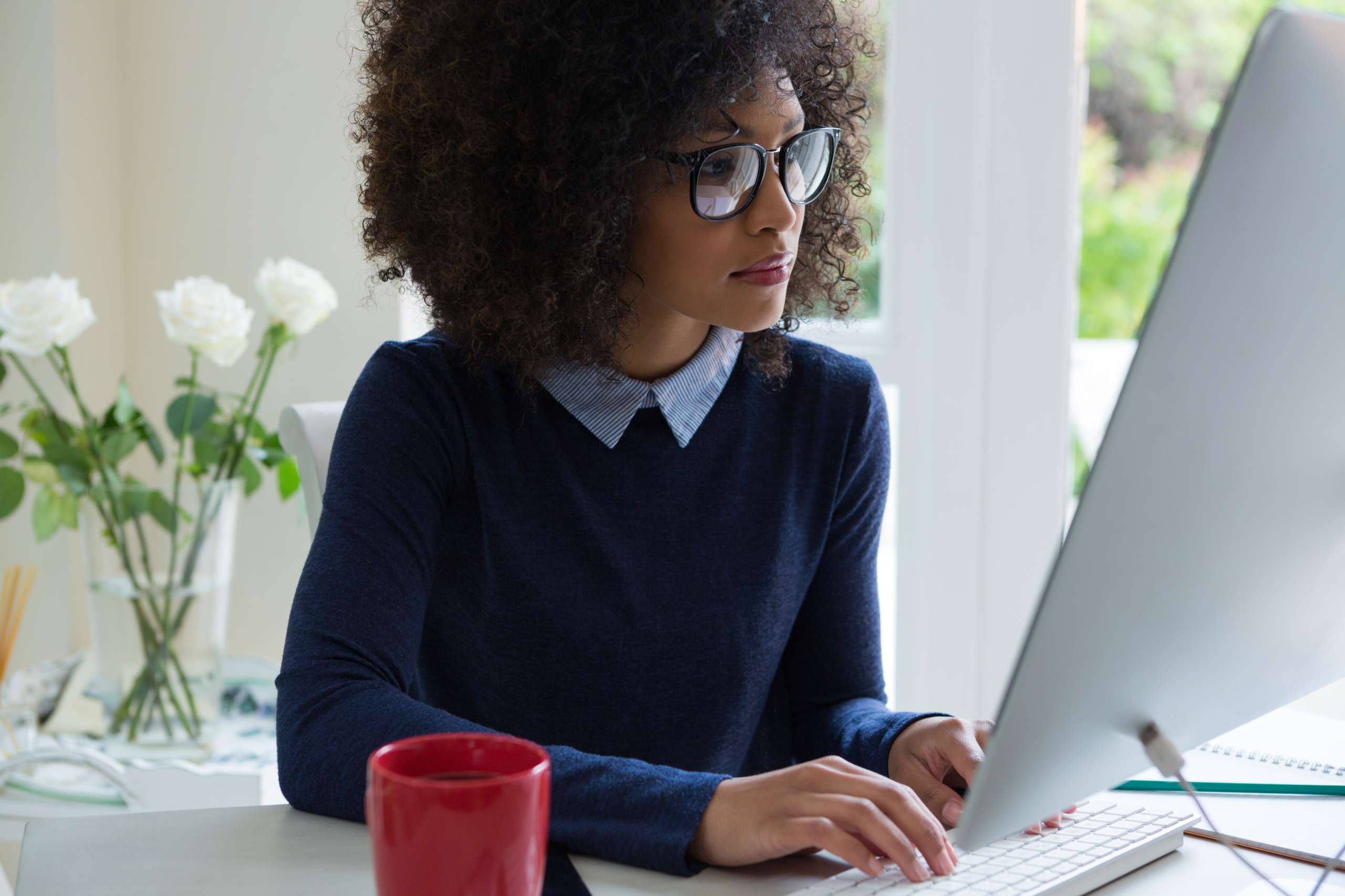 Woman working on our laptop