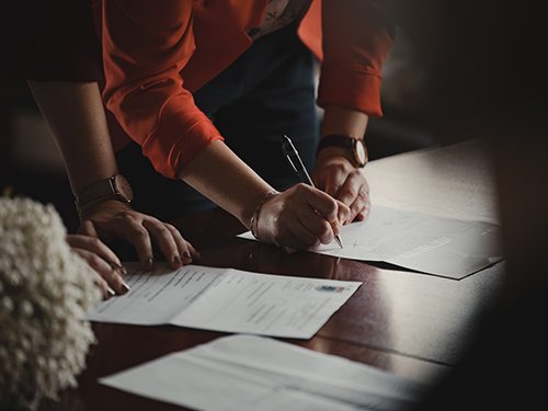 Paralegal reviewing documents with client