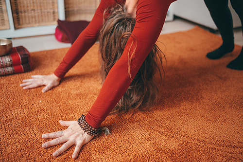 lady doing yoga pose at home