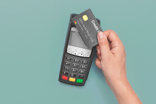 A POS machine accepting a tap payment.
