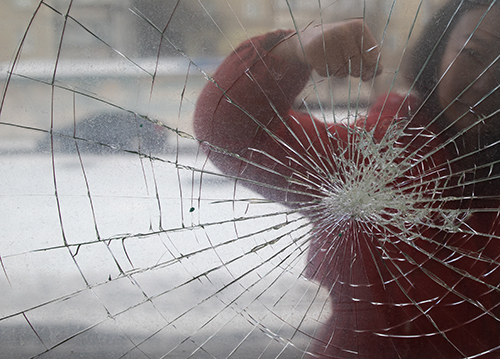 Angry customer breaks business store window