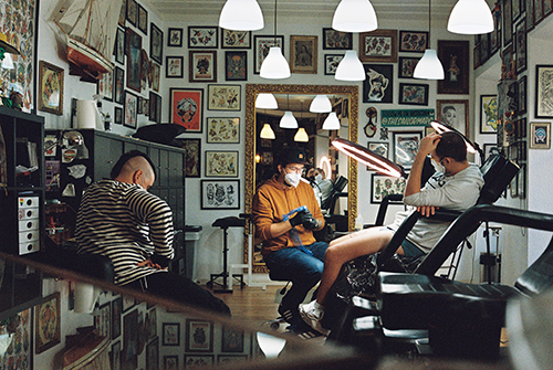 Customer inside tattoo parlour