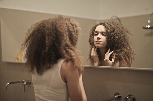 Mirror Woman looking into the mirror