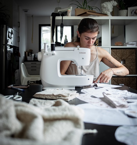 A woman sewing clothes