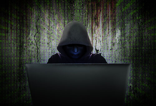 cyber-criminal Computer hacker in black