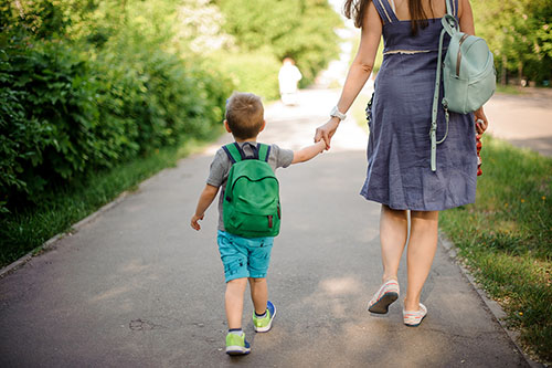 parent walking with child