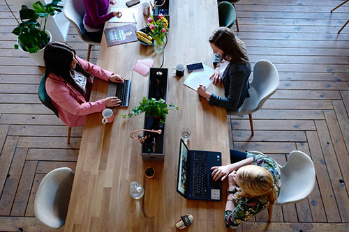 women working in a shared office