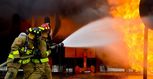 Firefighters extinguishing a blaze