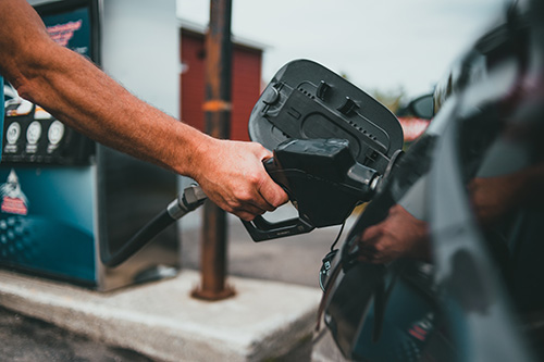 customer filling car with gas