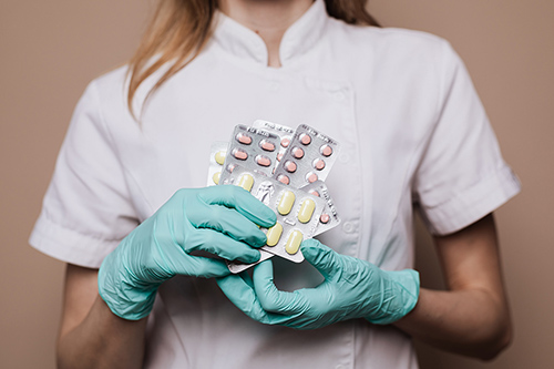 Nurse-medication nurse holding prescription medication