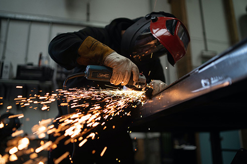 Welder working in shop