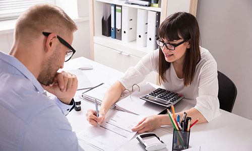 financial-planner Financial planner with client