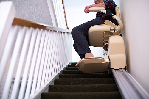 stairlift system senior person on home stairlift