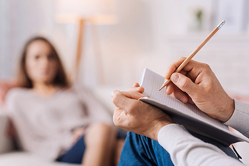 psychologist-therapy-session Professional psychologist conducting a