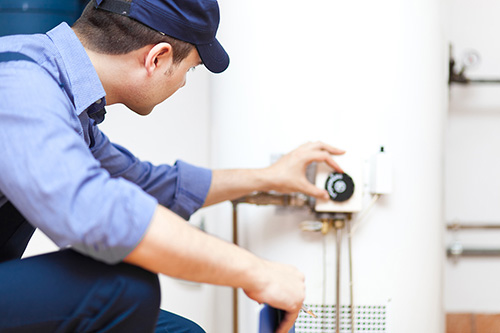 plumber installing water heater