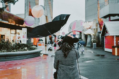 pedestrian on a windy street