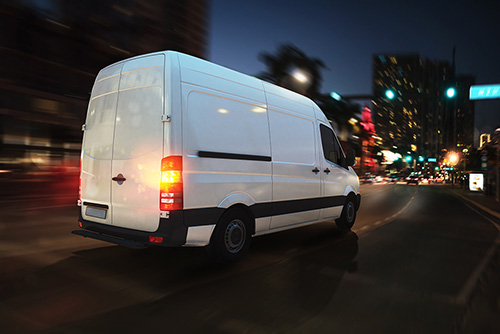 work van driving at night