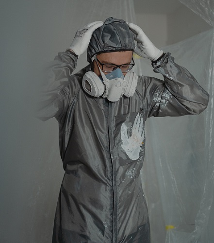 A worker showering after doing asbestos removal work