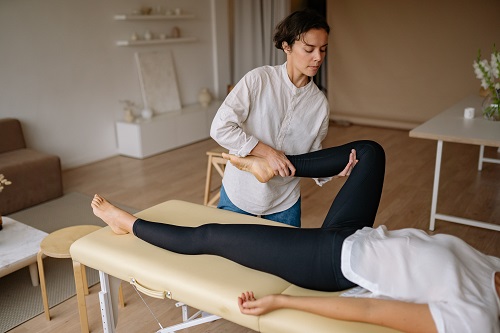 A registered massage therapist treating a patient