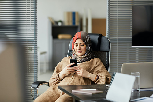 counsellor checking email on phone