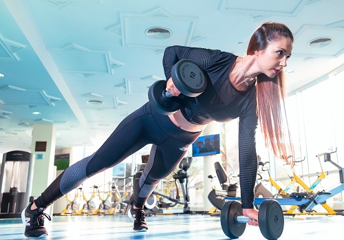 A woman exercising in a gym.