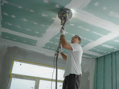 A home renovation contractor working at a job site.