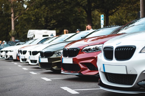 A fleet of parked business vehicles.