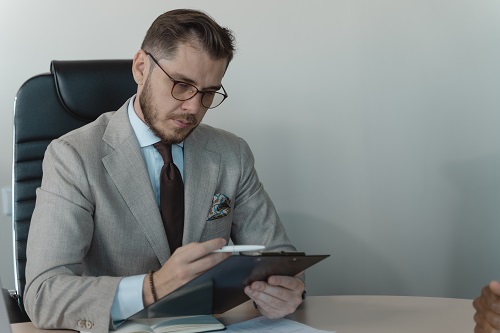 A man reading the details of his insurance policy.