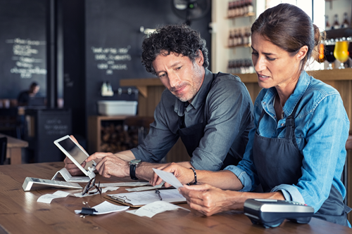 Business partners considering their options for finding a new insurance policy.