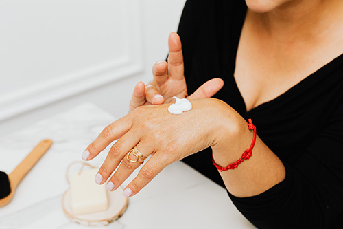 patient trying on hand lotion