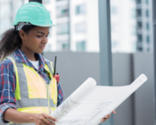 A contractor reviewing a blueprint.